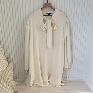Ivory Tie-Neck Long Sleeve Ruffle Hem Tunic